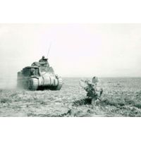 iCanvas An M3 Grant Tank On The Move During The Battle Of Kasserine by Stocktrek Images - Canvas Print