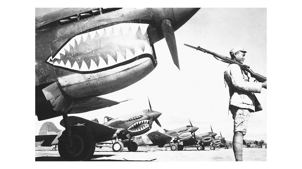 iCanvas A Chinese Soldier Guards A Line Of American P-40 Fighter Pla by Stocktrek Images Canvas Print, Multi, 18x12 TRK542-1PC3-18x12