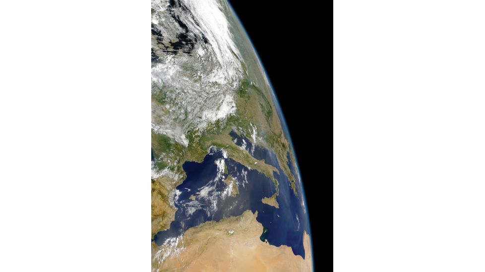 iCanvas View Of The Western Mediterranean With Visible Smoke In The by Stocktrek Images Canvas Print, Multi, 18x12 TRK1764-1PC3-18x12